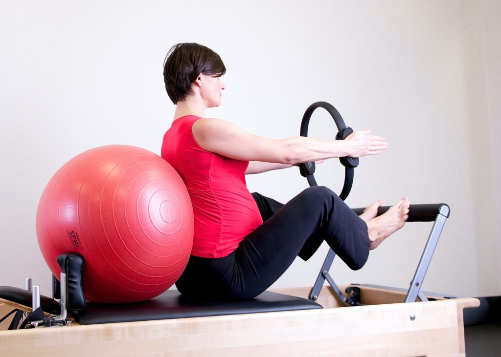 Pilates can be done with or without training equipment.
