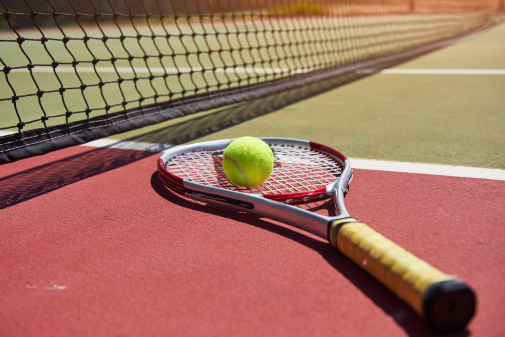 Tennis requires not only a rackquets  balls, but also a tennis uniform..